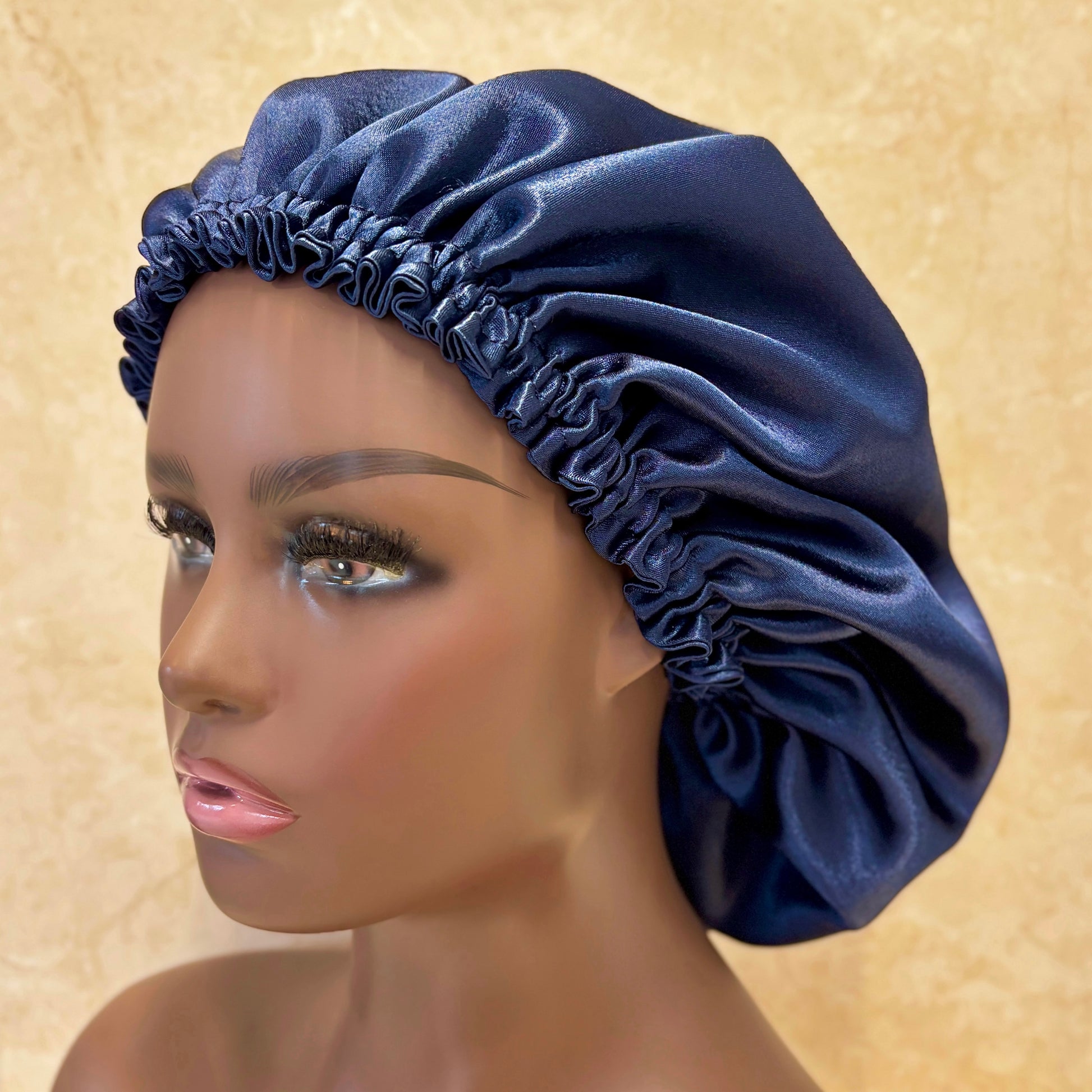 Navy blue satin bonnet on female Mannequin
