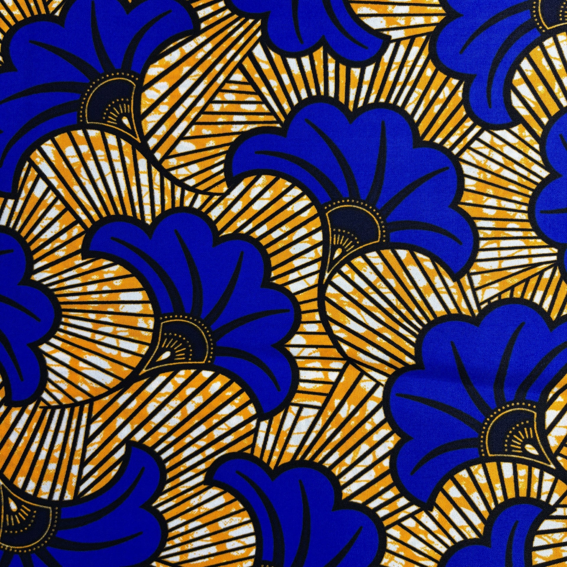 Blue and yellow floral African cotton print fabric.