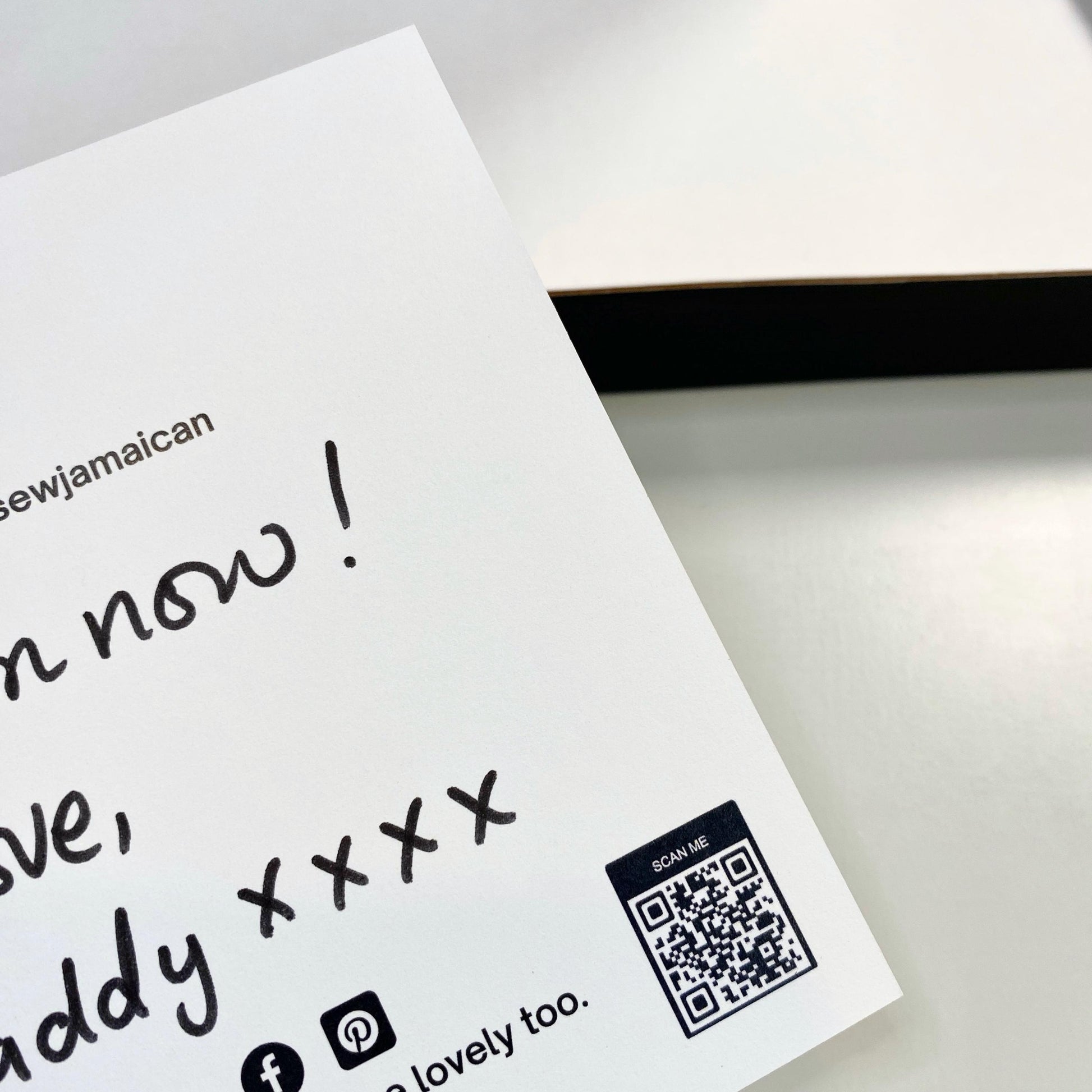 A handwritten thank you card with a personalised gift message, held in hand, for small business customer orders.