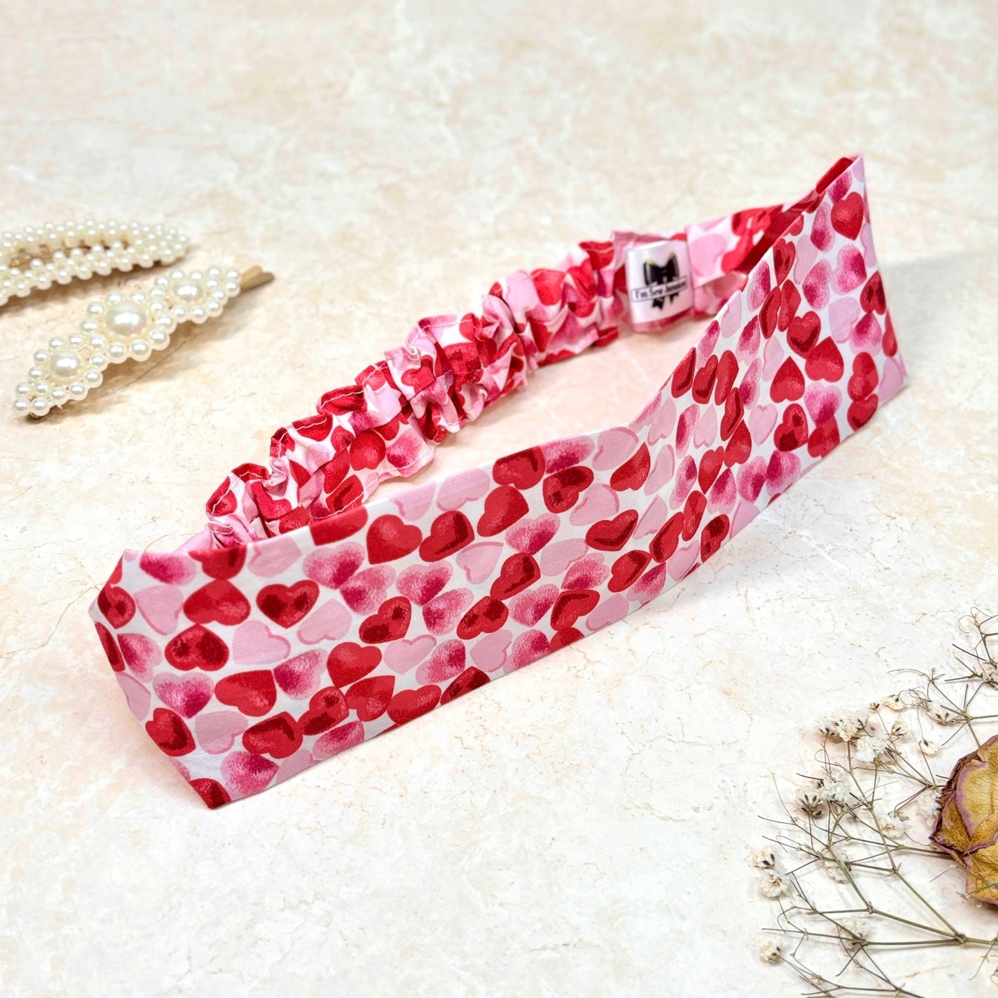 Cotton heart print pink and red headband thick, flat, wide stretch with props.