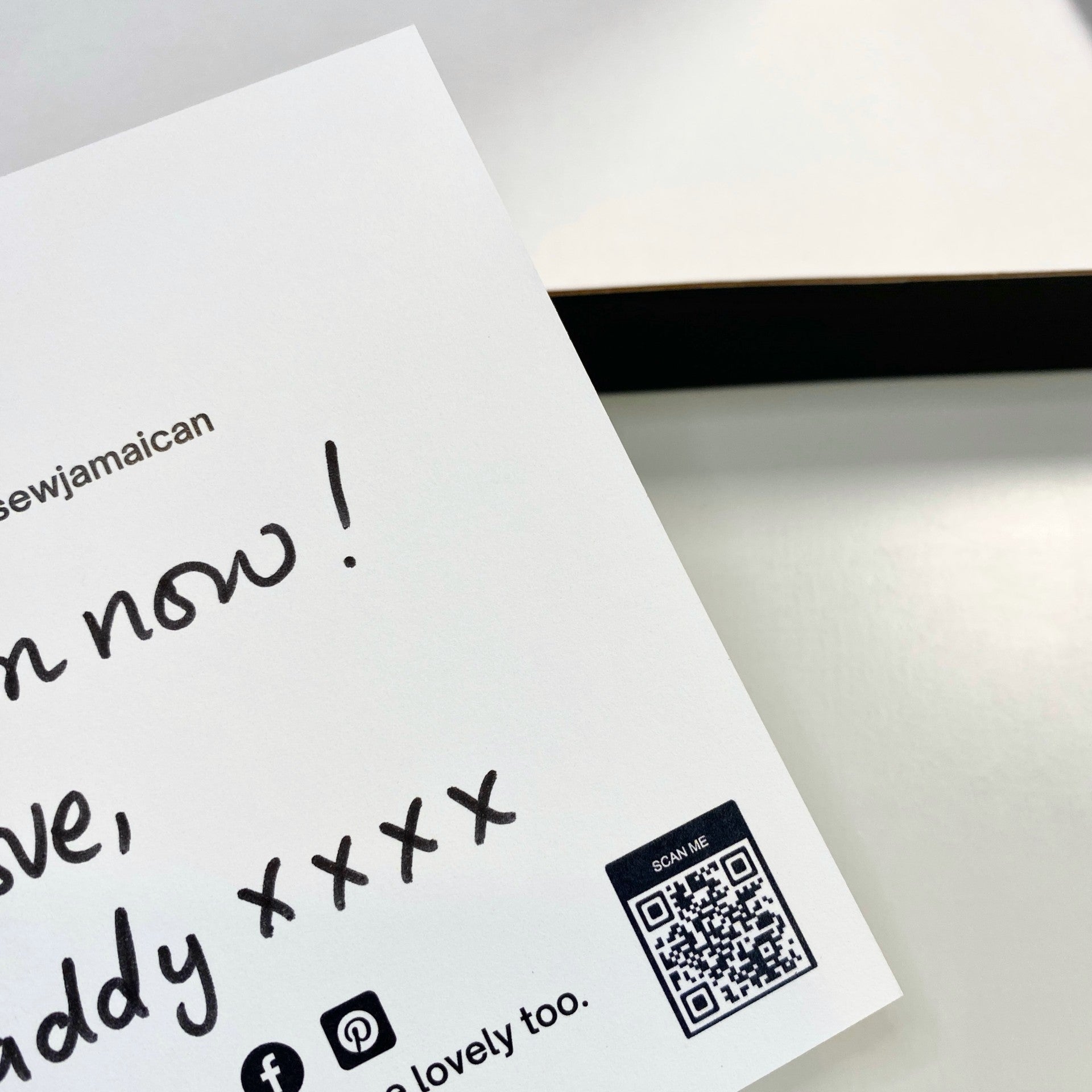 A handwritten thank you card with a personalised gift message, held in hand, for small business customer orders.