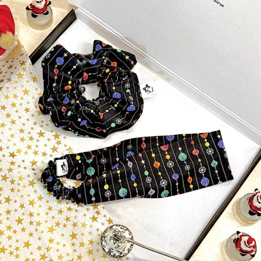 Black Christmas scrunchie with and headband set on a white gift box