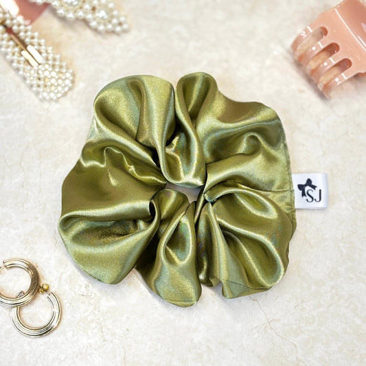 Olive green satin hair scrunchie with shine, stylish accessory for all hair types.
