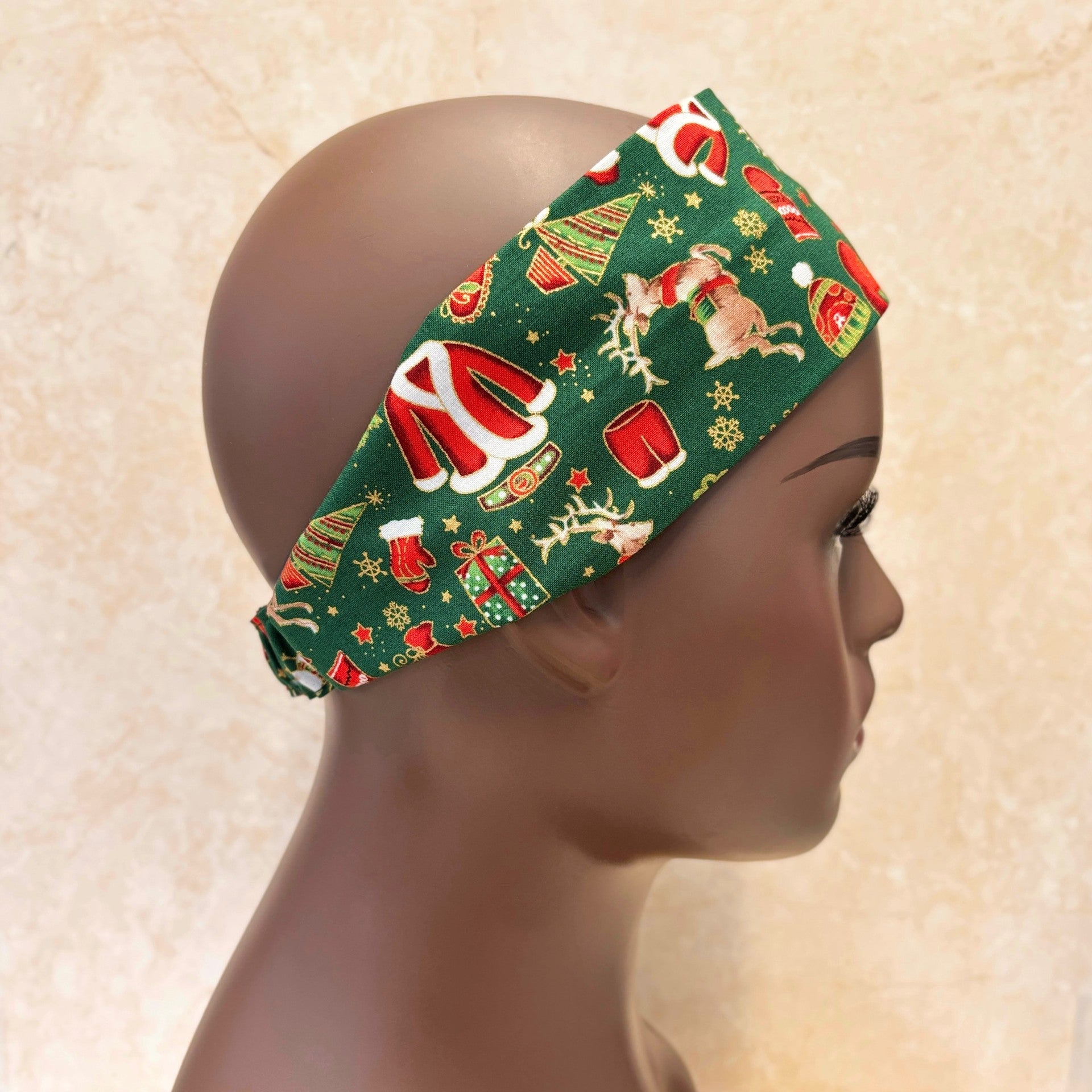 Christmas-themed headband on a mannequin head against a beige background