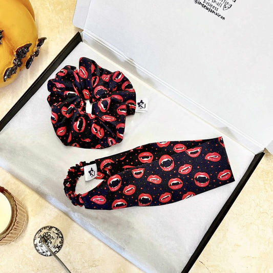 Set of Halloween scrunchie and headband with lip pattern on a white surface