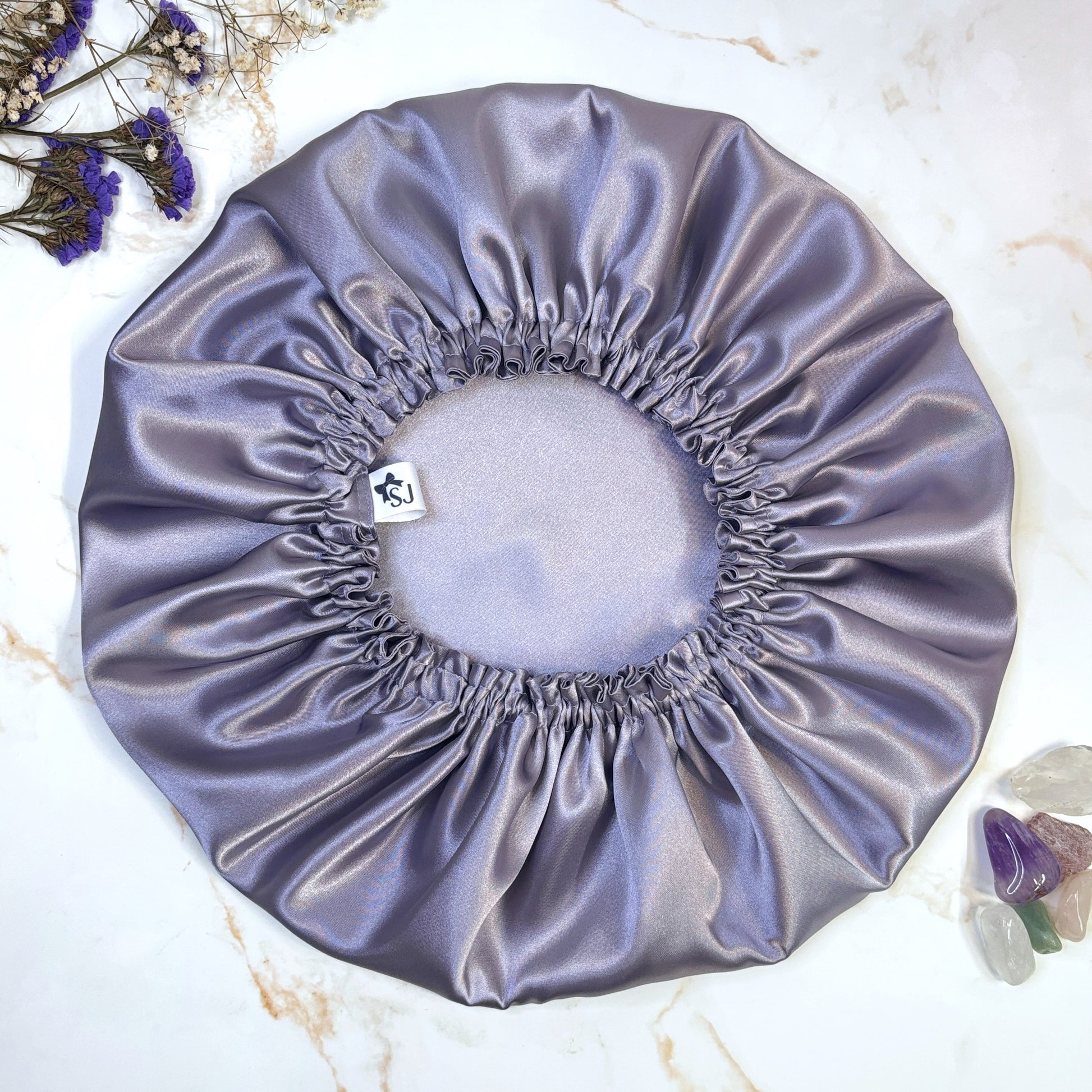Lilac satin bonnet flat lay