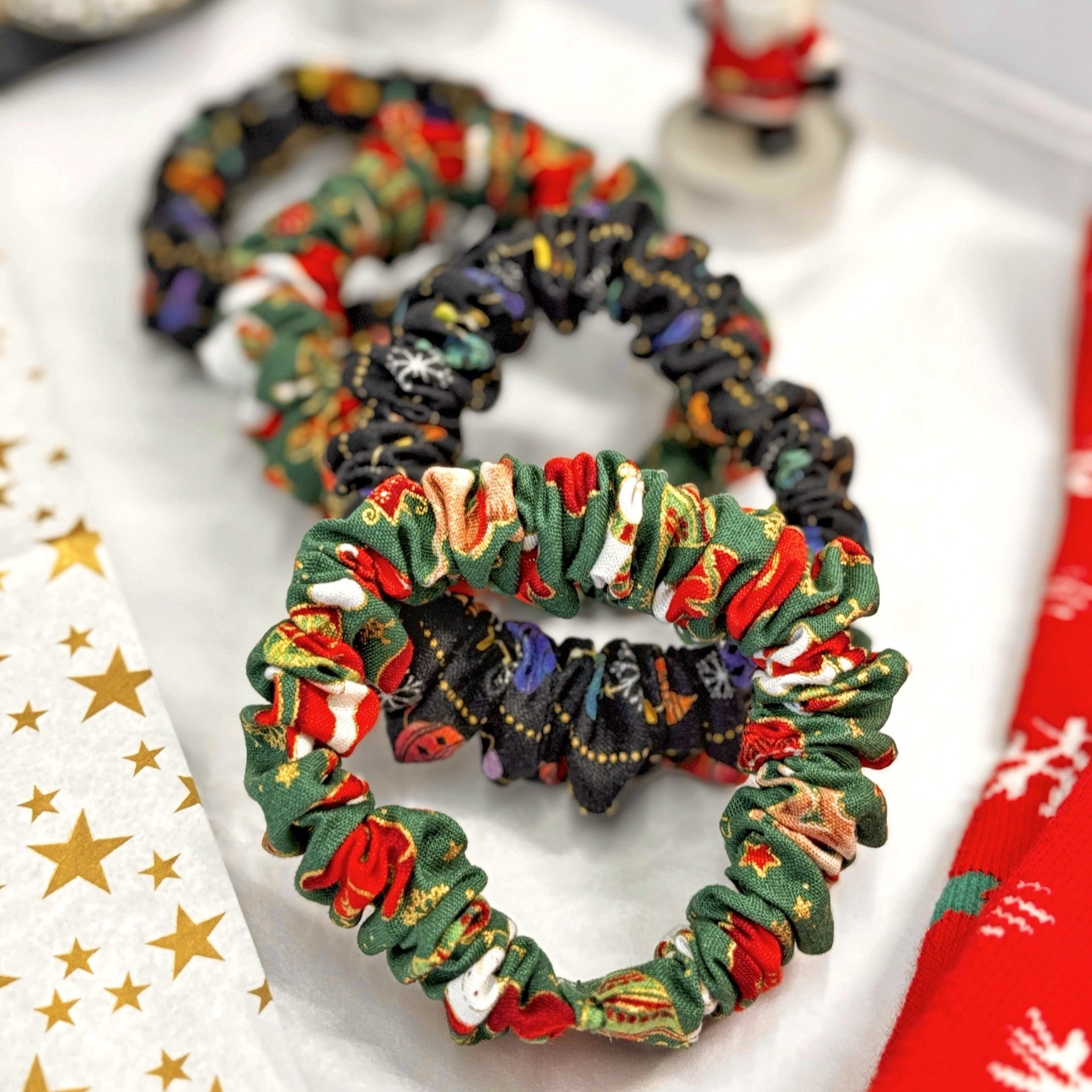 Colorful fabric Christmas skinny mini scrunchies on gift box