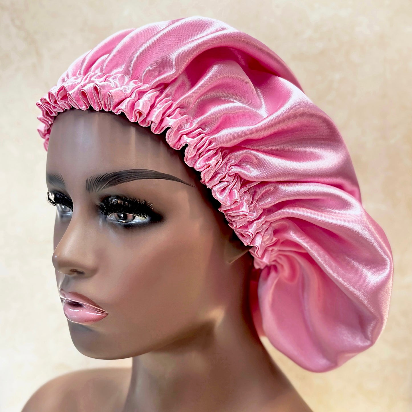 pink satin bonnet on mannequin head