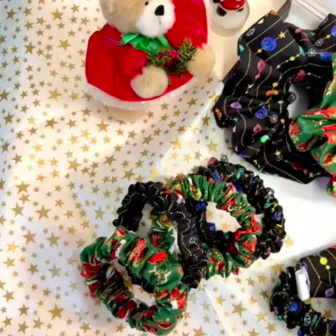 Festive Christmas scrunchies and headbands with holiday-themed prints in gift box