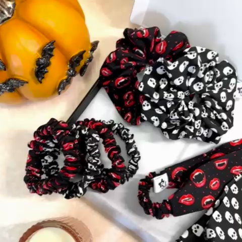 Halloween scrunchies and headbands with black and white skull pattern and red and black vampire lips pattern in gift box